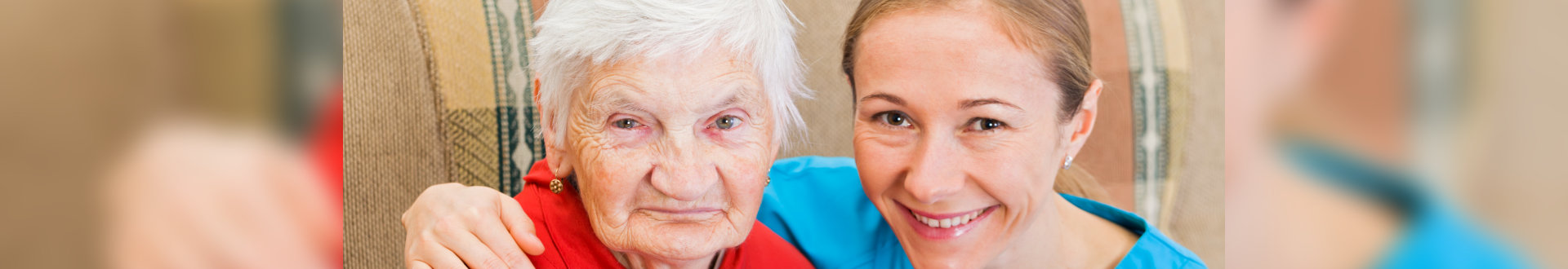 Elderly woman and young caregiver