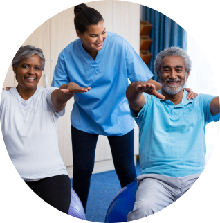 caregiver with seniors doing exercise